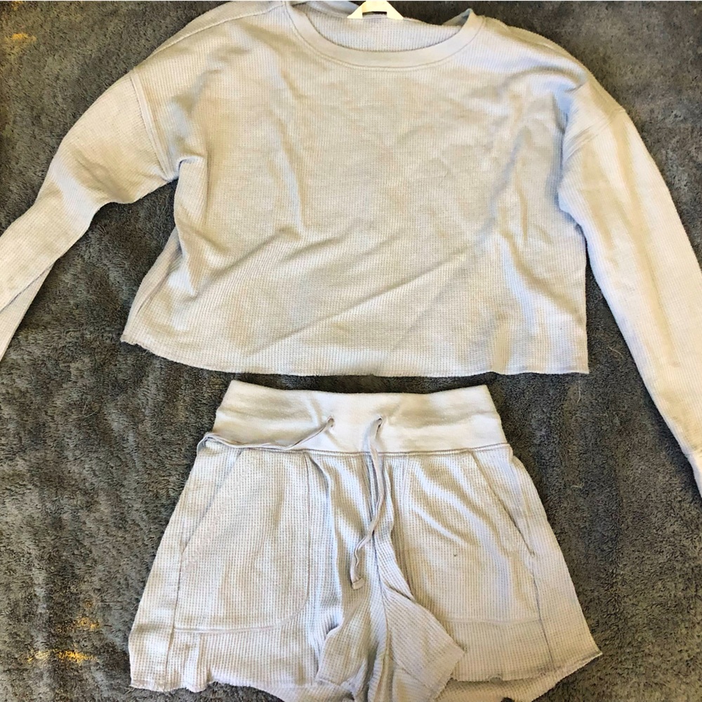 Long sleeved shirt and shorts matching set.